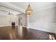 Open living space with a fireplace, hardwood floors, and access to the outdoors at 907 Ospre Ln, Fort Mill, SC 29708