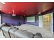 Media room with projector screen, comfortable seating, and bright ceiling lighting at 9825 Ardrey Woods Dr, Charlotte, NC 28277