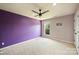Bright bedroom features plush carpeting, a ceiling fan, and natural light from a window at 9825 Ardrey Woods Dr, Charlotte, NC 28277