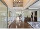 Elegant foyer with hardwood floors, staircase, and open floor plan at 9825 Ardrey Woods Dr, Charlotte, NC 28277
