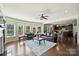 Bright living room with fireplace, hardwood floors, and plenty of seating at 9825 Ardrey Woods Dr, Charlotte, NC 28277