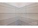 Walk-in pantry with organized shelving and ample storage space at 9825 Ardrey Woods Dr, Charlotte, NC 28277