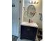 Bathroom features a modern vanity, oval mirror, and updated lighting at 106 E Gibbs St, Dallas, NC 28034