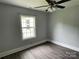 Bright bedroom with luxury vinyl plank flooring and a ceiling fan at 106 E Gibbs St, Dallas, NC 28034