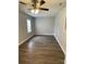 Spacious bedroom with updated flooring and ceiling fan at 106 E Gibbs St, Dallas, NC 28034