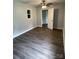 Comfortable bedroom with updated flooring and open doorway at 106 E Gibbs St, Dallas, NC 28034