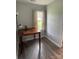 Cozy bedroom nook with natural light, a desk, and simple flooring at 106 E Gibbs St, Dallas, NC 28034