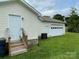 Exterior view of house featuring deck and attached garage at 106 E Gibbs St, Dallas, NC 28034