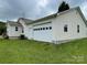 This home features a convenient attached garage, providing secure parking and additional storage space at 106 E Gibbs St, Dallas, NC 28034