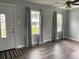 Inviting living room featuring modern gray walls and vinyl flooring at 106 E Gibbs St, Dallas, NC 28034