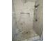 Stylish marble-tiled shower with rainfall showerhead and convenient niche at 106 E Gibbs St, Dallas, NC 28034