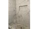Elegant marble-tiled shower with a corner seat and built-in shelf at 106 E Gibbs St, Dallas, NC 28034