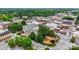 An aerial view of a quaint downtown area with historic buildings and lush green trees at 1117 Hallman Branch Ln, Lincolnton, NC 28092