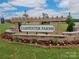 Landscaped entrance sign to Carpenter Farms with flowers and greenery at 1117 Hallman Branch Ln, Lincolnton, NC 28092