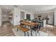 Stylish dining area with wooden table, modern chairs, and an adjacent kitchen at 1117 Hallman Branch Ln, Lincolnton, NC 28092