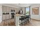 Modern kitchen with gray cabinets, granite countertops, and stainless steel appliances at 1117 Hallman Branch Ln, Lincolnton, NC 28092