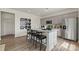 Modern kitchen features a large island with granite countertops, stainless steel appliances, and light purple cabinets at 1117 Hallman Branch Ln, Lincolnton, NC 28092