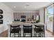 Stylish kitchen with gray cabinets, a large island, and modern bar stools at 1117 Hallman Branch Ln, Lincolnton, NC 28092