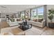Bright living room with large windows, stylish decor, and hardwood floors at 1117 Hallman Branch Ln, Lincolnton, NC 28092