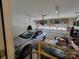 Spacious garage with car, storage, and door at 1132 Preakness Nw Ct # 24, Concord, NC 28027