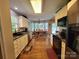 Modern kitchen with white cabinets, stainless steel appliances, and a seamless transition to the dining area at 1132 Preakness Nw Ct # 24, Concord, NC 28027