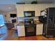 Efficient kitchen with granite countertops and appliances, located adjacent to the living area at 1132 Preakness Nw Ct # 24, Concord, NC 28027