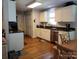 Bright kitchen with hardwood floors, stainless steel appliances, and white cabinets at 1132 Preakness Nw Ct # 24, Concord, NC 28027
