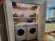 Laundry closet with stacked washer and dryer, shelving, and storage space at 1132 Preakness Nw Ct # 24, Concord, NC 28027