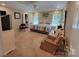 Spacious main bedroom with natural light, ceiling fan, and a sitting area at 1132 Preakness Nw Ct # 24, Concord, NC 28027