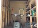 Organized shed with pegboard, tools and shelves, providing storage for lawn and garden at 1132 Preakness Nw Ct # 24, Concord, NC 28027