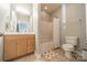 Bright bathroom features a shower and tub combination and light wood vanity at 123 Archbell Point Ln, Mooresville, NC 28117