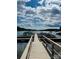 Picturesque dock features multiple boat slips and a scenic lake view under a cloudy sky at 123 Archbell Point Ln, Mooresville, NC 28117