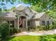 Charming, two-story brick home with an American flag hanging near the front door at 123 Archbell Point Ln, Mooresville, NC 28117