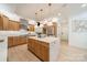 Spacious kitchen featuring a marble island, stainless steel appliances, and custom wood cabinets at 123 Archbell Point Ln, Mooresville, NC 28117