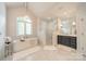 Elegant main bathroom featuring a freestanding tub, glass shower, and vanity with plenty of storage at 123 Archbell Point Ln, Mooresville, NC 28117