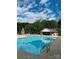 A large, inviting pool with lounge chairs and clear blue water for a refreshing experience at 123 Archbell Point Ln, Mooresville, NC 28117