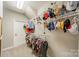 Organized walk-in closet with shelving provides ample storage for clothes and accessories at 123 Archbell Point Ln, Mooresville, NC 28117