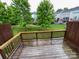 Spacious back deck with lush greenery and community landscape views at 1295 Amber Ridge Nw Rd, Concord, NC 28027
