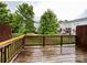 View from the back deck overlooking a community lawn and mature trees at 1295 Amber Ridge Nw Rd, Concord, NC 28027