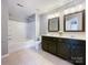 Neutral bathroom featuring a shower-tub combo, toilet, and a large dual vanity at 1295 Amber Ridge Nw Rd, Concord, NC 28027