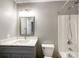 Bathroom featuring gray vanity with granite countertop and shower-tub combo at 1295 Amber Ridge Nw Rd, Concord, NC 28027