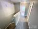 Hallway and stairway up to the third level with view into bedroom at 1295 Amber Ridge Nw Rd, Concord, NC 28027