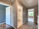 Upstairs hallway with entryways into the bathroom and bedroom at 1295 Amber Ridge Nw Rd, Concord, NC 28027