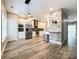 Open kitchen and dining area features stainless steel appliances and modern countertops at 1295 Amber Ridge Nw Rd, Concord, NC 28027
