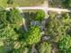 Aerial view of a tree-lined property featuring lush greenery and a long driveway at 130 Casper Rd, Gold Hill, NC 28071