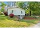 Exterior backyard view of a home featuring brick flower beds and landscaping at 130 Casper Rd, Gold Hill, NC 28071