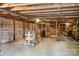 Unfinished basement with block walls, stairs, and exposed ceiling at 130 Casper Rd, Gold Hill, NC 28071