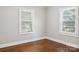Bedroom featuring hardwood floors and two windows allowing natural light at 130 Casper Rd, Gold Hill, NC 28071