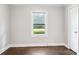 Cozy bedroom with hardwood floors, natural light, and a view of the outdoors at 130 Casper Rd, Gold Hill, NC 28071