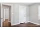 Cozy bedroom featuring hardwood floors, neutral paint, and ample closet space at 130 Casper Rd, Gold Hill, NC 28071